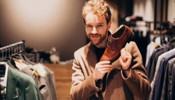 young-handsome-man-choosing-shoes-shop (1)